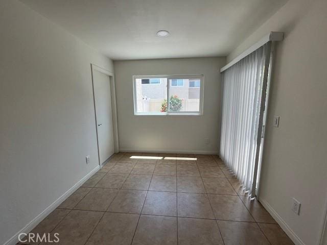45 Golden Glen St Unit 75, Irvine, CA 92604 - tiled spare room with baseboards