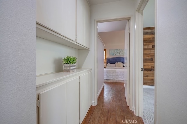 7712 Rockybrook Way, Stanton, CA 90680 - corridor featuring dark wood-style flooring and baseboards