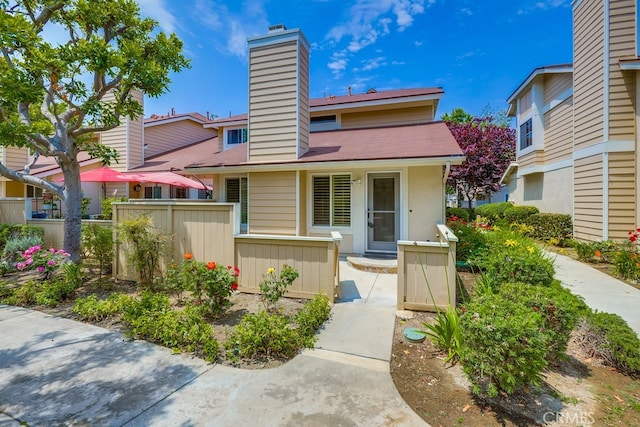 7712 Rockybrook Way, Stanton, CA 90680 - view of front of property featuring a chimney and a shingled roof