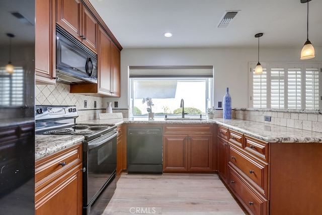 7712 Rockybrook Way, Stanton, CA 90680 - kitchen featuring black appliances, a sink, light wood-style flooring, decorative backsplash, and light stone counters