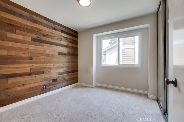 7712 Rockybrook Way, Stanton, CA 90680 - spare room featuring wooden walls, light carpet, and baseboards