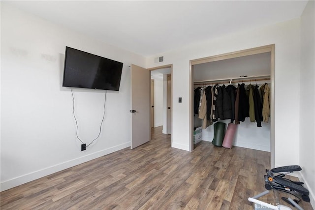 1505 Cypress Ln, Lemoore, CA 93245 - unfurnished bedroom with a closet, wood finished floors, and baseboards