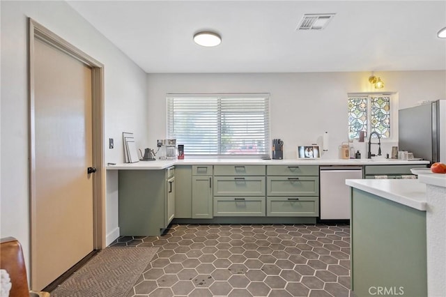 1505 Cypress Ln, Lemoore, CA 93245 - kitchen featuring green cabinetry, appliances with stainless steel finishes, and light countertops