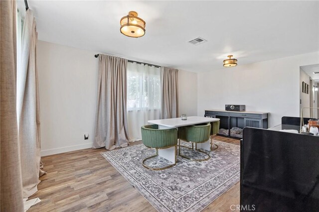 1505 Cypress Ln, Lemoore, CA 93245 - dining room with light wood-style floors and baseboards