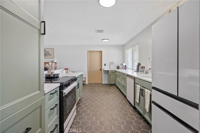 1505 Cypress Ln, Lemoore, CA 93245 - kitchen with electric range oven, green cabinets, light countertops, and dishwashing machine