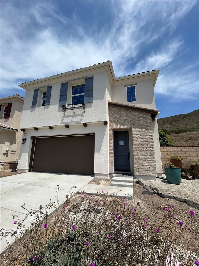 320 Fraser Pt, Camarillo, CA 93012 - view of front facade with a garage, stucco siding, driveway, and stone siding
