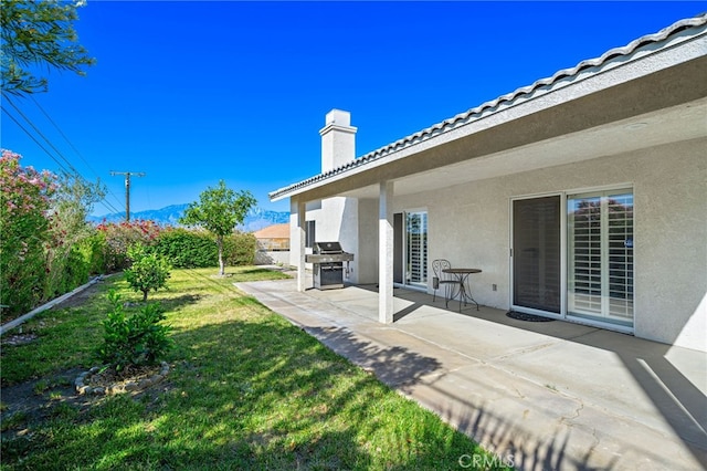 9552 Palm Dr, Desert Hot Springs, CA 92240 - view of green lawn with a patio