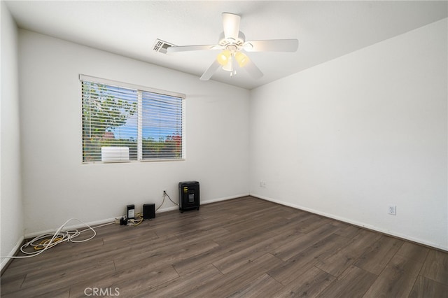 9552 Palm Dr, Desert Hot Springs, CA 92240 - spare room featuring wood finished floors, a ceiling fan, and baseboards
