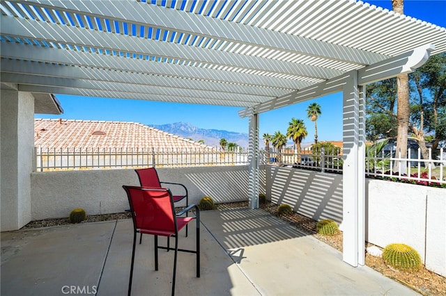 9552 Palm Dr, Desert Hot Springs, CA 92240 - view of patio / terrace with a pergola and a mountain view