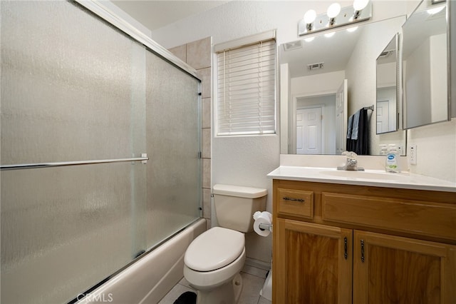 9552 Palm Dr, Desert Hot Springs, CA 92240 - bathroom with toilet, vanity, bath / shower combo with glass door, and tile patterned flooring