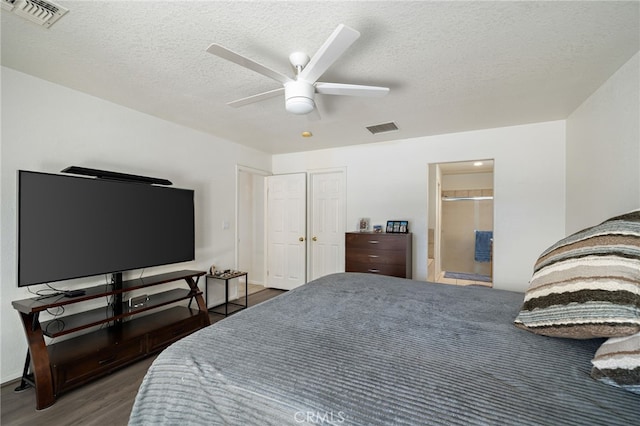 9552 Palm Dr, Desert Hot Springs, CA 92240 - bedroom featuring wood finished floors, a textured ceiling, and ceiling fan