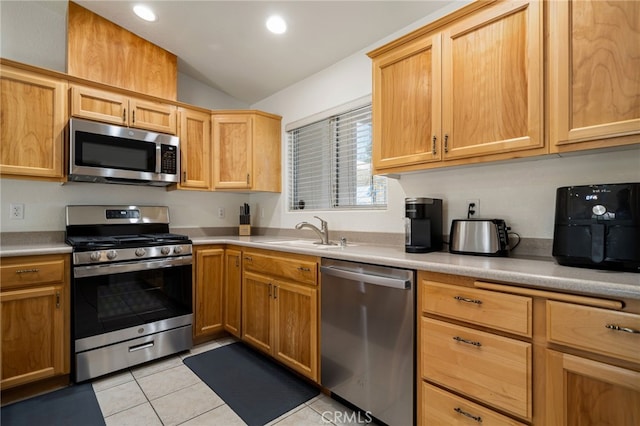 9552 Palm Dr, Desert Hot Springs, CA 92240 - kitchen with appliances with stainless steel finishes, lofted ceiling, a sink, light countertops, and light tile patterned floors