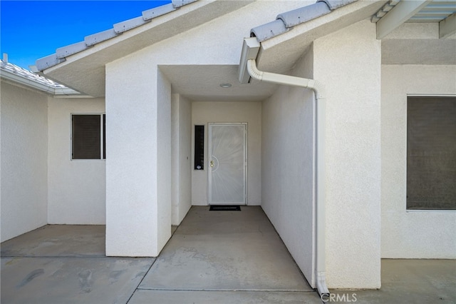9552 Palm Dr, Desert Hot Springs, CA 92240 - property entrance with stucco siding