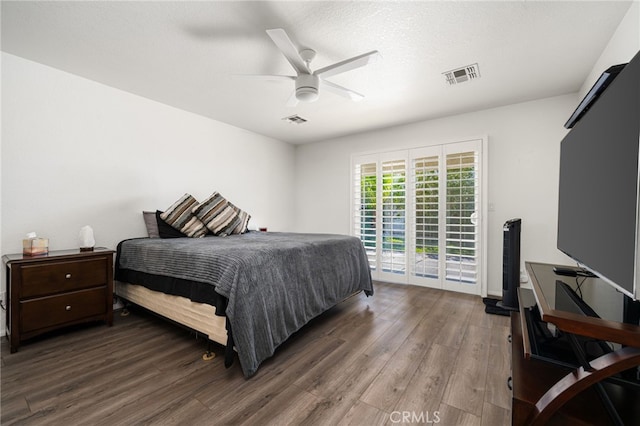 9552 Palm Dr, Desert Hot Springs, CA 92240 - bedroom featuring access to exterior, wood finished floors, and ceiling fan