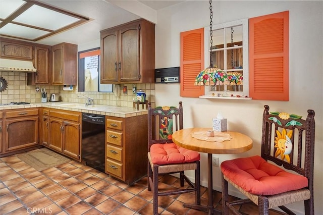 537 3rd St, Manhattan Beach, CA 90266 - kitchen featuring black dishwasher, backsplash, custom range hood, and tile counters