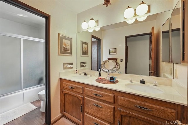 537 3rd St, Manhattan Beach, CA 90266 - full bathroom with double vanity, combined bath / shower with glass door, and wood finished floors
