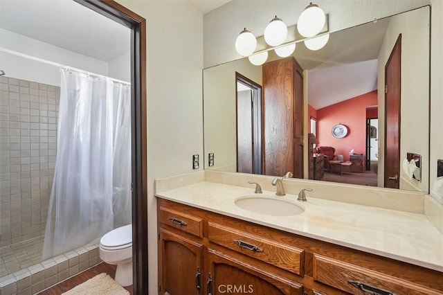 537 3rd St, Manhattan Beach, CA 90266 - ensuite bathroom featuring a tile shower, vanity, vaulted ceiling, and wood finished floors