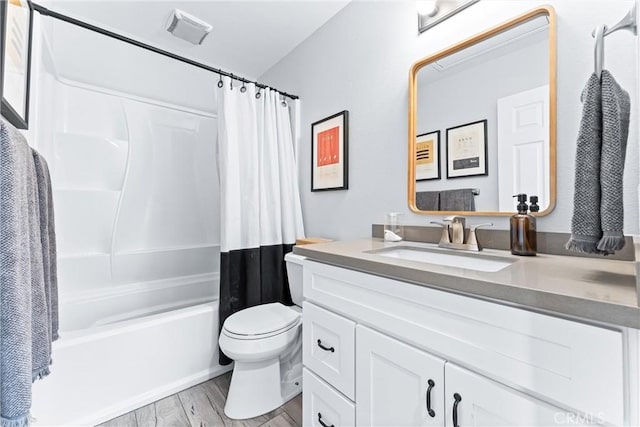 5847 E Rocking Horse Way Unit 21, Orange, CA 92869 - full bath featuring vanity, shower / tub combo, toilet, and wood finished floors