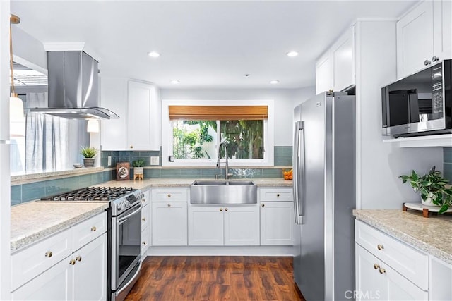 5847 E Rocking Horse Way Unit 21, Orange, CA 92869 - kitchen with stainless steel appliances, a sink, island range hood, backsplash, and white cabinets
