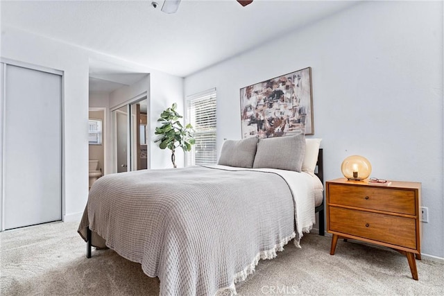 5847 E Rocking Horse Way Unit 21, Orange, CA 92869 - bedroom featuring carpet, connected bathroom, and baseboards