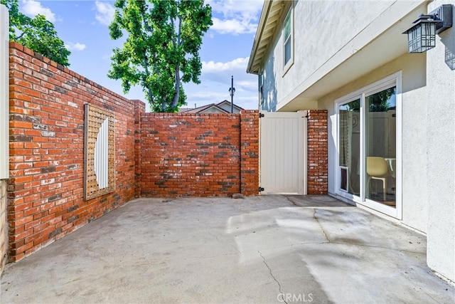 5847 E Rocking Horse Way Unit 21, Orange, CA 92869 - view of patio / terrace featuring a gate