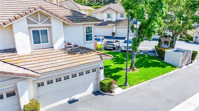 5847 E Rocking Horse Way Unit 21, Orange, CA 92869 - traditional home featuring stucco siding, a garage, a tiled roof, and a front lawn