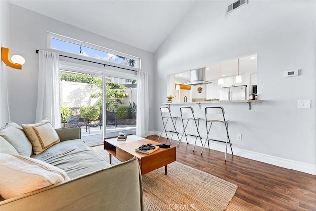 5847 E Rocking Horse Way Unit 21, Orange, CA 92869 - living room with high vaulted ceiling, baseboards, and wood finished floors