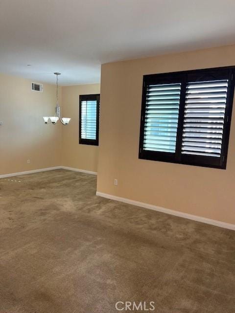 16089 Gables Loop, Whittier, CA 90603 - empty room featuring baseboards, carpet flooring, and a chandelier