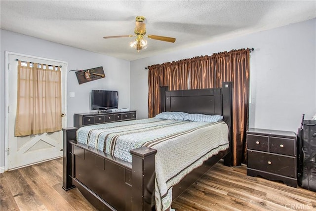 1210 3rd St, Calimesa, CA 92320 - bedroom with wood finished floors, ceiling fan, and a textured ceiling