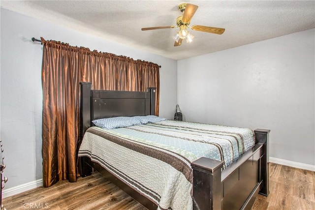 1210 3rd St, Calimesa, CA 92320 - bedroom featuring wood finished floors, a textured ceiling, and ceiling fan