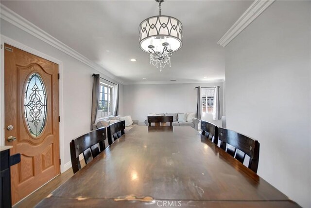 3879 Big Dalton Ave, Baldwin Park, CA 91706 - dining area featuring wood finished floors, ornamental molding, a chandelier, recessed lighting, and baseboards