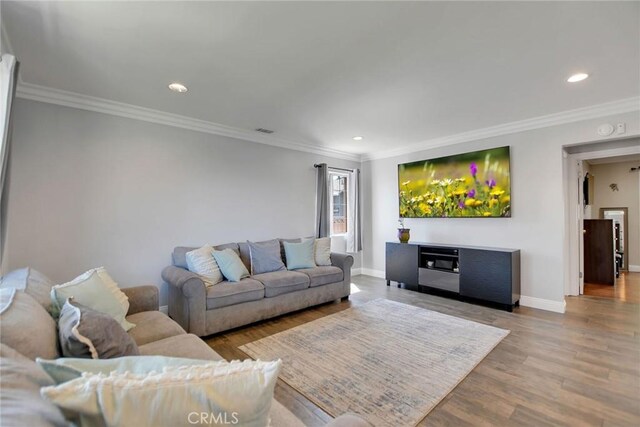 3879 Big Dalton Ave, Baldwin Park, CA 91706 - living room with wood finished floors, baseboards, recessed lighting, and crown molding