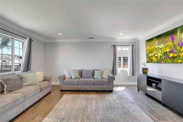 3879 Big Dalton Ave, Baldwin Park, CA 91706 - living room with wood finished floors, baseboards, recessed lighting, and crown molding