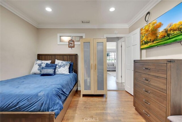 3879 Big Dalton Ave, Baldwin Park, CA 91706 - bedroom with light wood-style flooring, ornamental molding, and recessed lighting