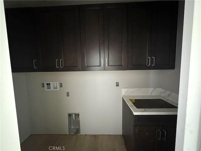 14549 Live Oak St, Hesperia, CA 92345 - washroom featuring hookup for a washing machine, cabinet space, electric dryer hookup, and wood finished floors