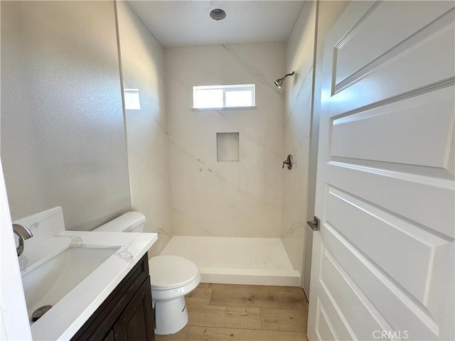 14549 Live Oak St, Hesperia, CA 92345 - full bathroom with toilet, wood finished floors, a stall shower, and vanity