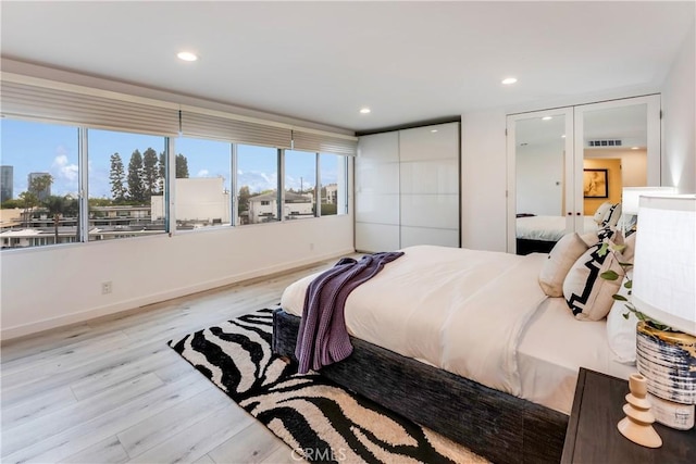 875 Comstock Ave Unit 4D, Los Angeles, CA 90024 - bedroom featuring light wood-style floors, recessed lighting, and baseboards