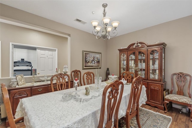 15691 Cherry Leaf Ln, Fontana, CA 92336 - dining room with a chandelier and wood finished floors