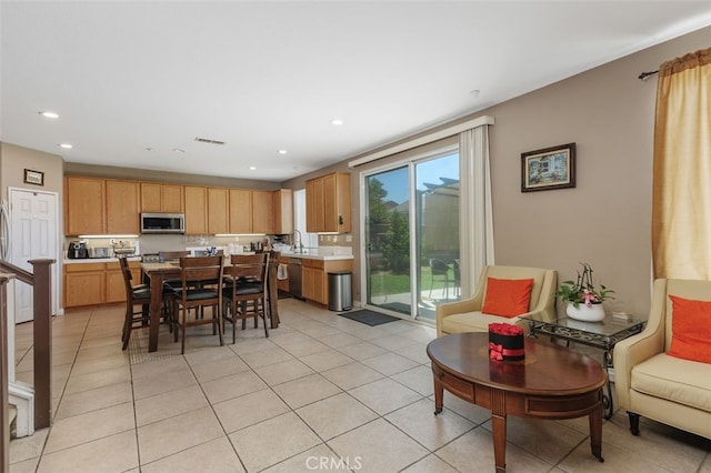 15691 Cherry Leaf Ln, Fontana, CA 92336 - dining area with light tile patterned floors and recessed lighting
