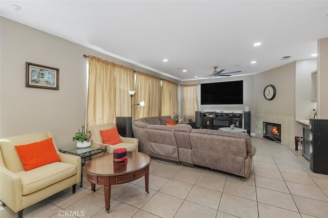 15691 Cherry Leaf Ln, Fontana, CA 92336 - living area with a fireplace, ceiling fan, recessed lighting, and light tile patterned floors