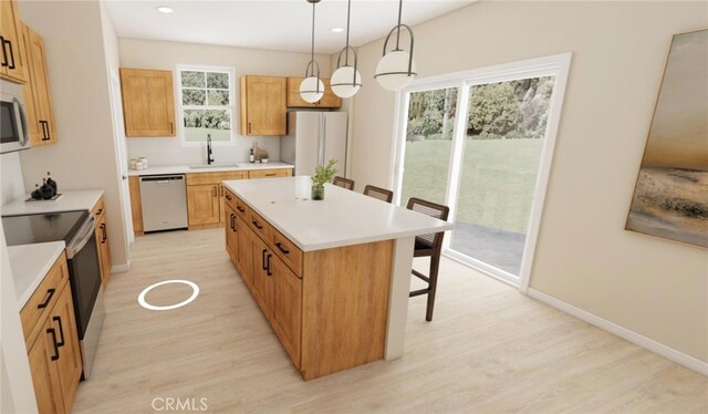 30560 Paul Ln, Winchester, CA 92596 - kitchen with white appliances, a sink, light wood-style floors, a breakfast bar, and a center island