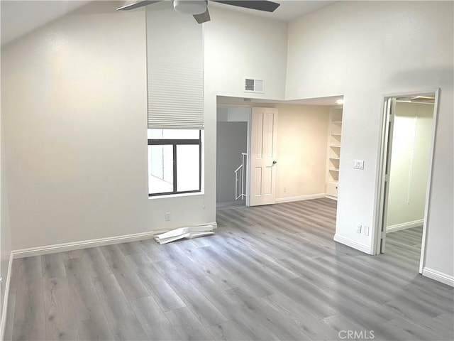 9738 Walker St Unit 1, Cypress, CA 90630 - empty room with high vaulted ceiling, ceiling fan, wood finished floors, and baseboards