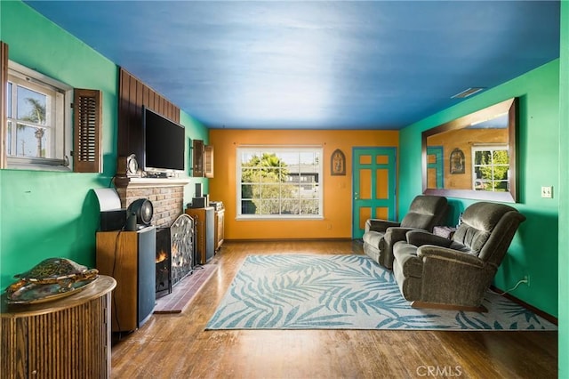 950 N Laurel Dr, Orange, CA 92867 - living area featuring wood finished floors, a fireplace, and baseboards
