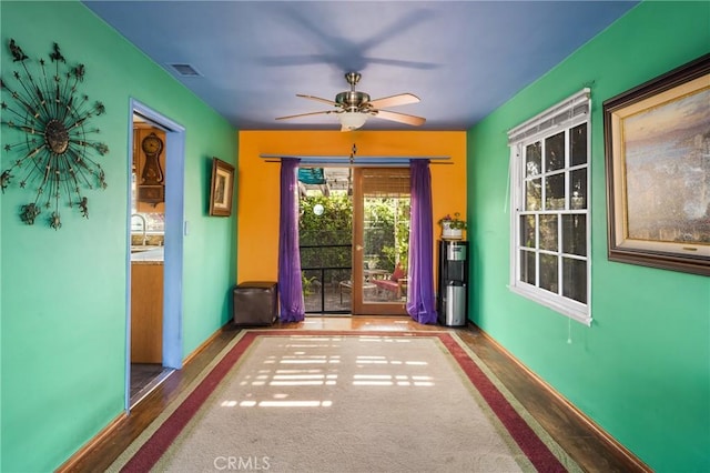 950 N Laurel Dr, Orange, CA 92867 - doorway featuring ceiling fan, a sink, and baseboards