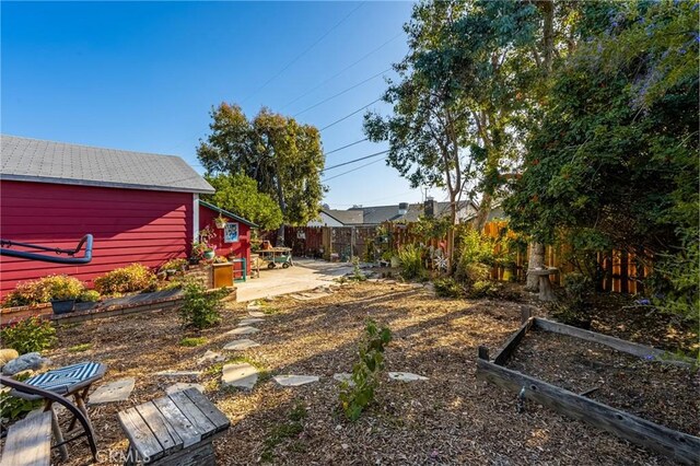 950 N Laurel Dr, Orange, CA 92867 - fenced backyard featuring a patio area and a vegetable garden