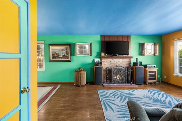 950 N Laurel Dr, Orange, CA 92867 - living area with a fireplace, wood finished floors, and baseboards