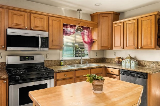 950 N Laurel Dr, Orange, CA 92867 - kitchen featuring stainless steel appliances, a sink, wood counters, brown cabinets, and recessed lighting