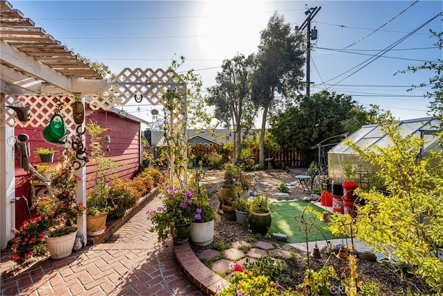 950 N Laurel Dr, Orange, CA 92867 - fenced backyard featuring an exterior structure, an outdoor structure, and a patio area
