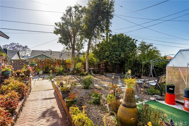 950 N Laurel Dr, Orange, CA 92867 - fenced backyard featuring a patio area and a greenhouse