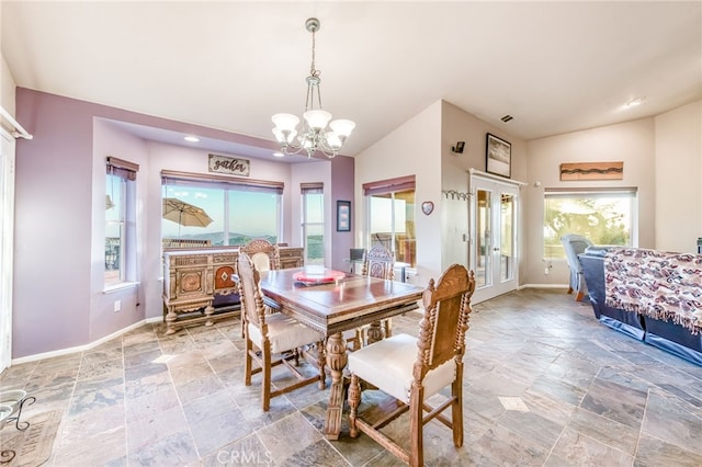 50806 Bramble Ln, Squaw Valley, CA 93675 - dining area featuring stone tile flooring, a chandelier, lofted ceiling, recessed lighting, and french doors